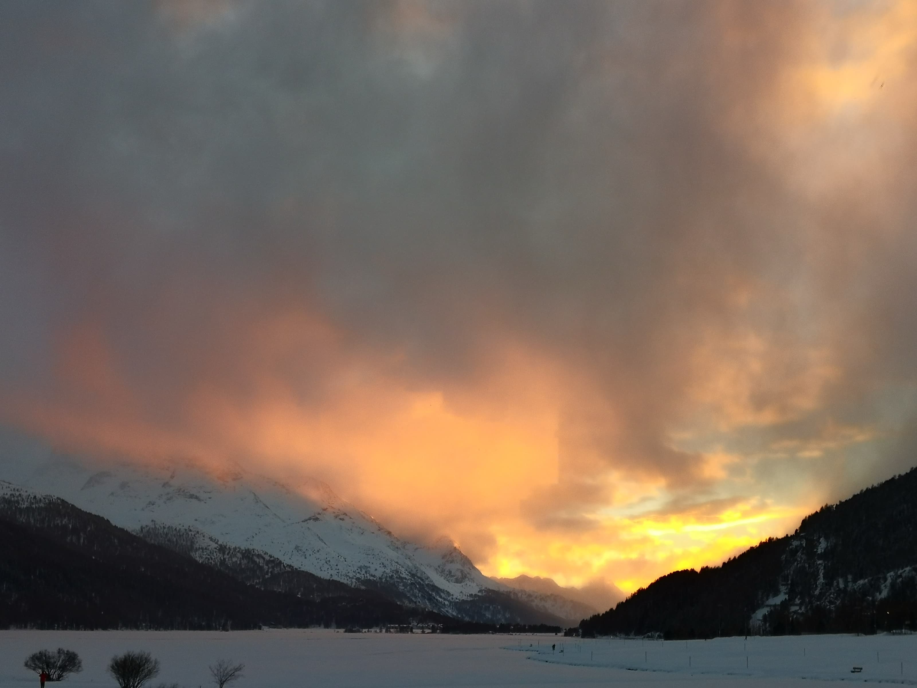 Panoramic winter view of the Upper Engadin valley and St. Moritz alpine lakes